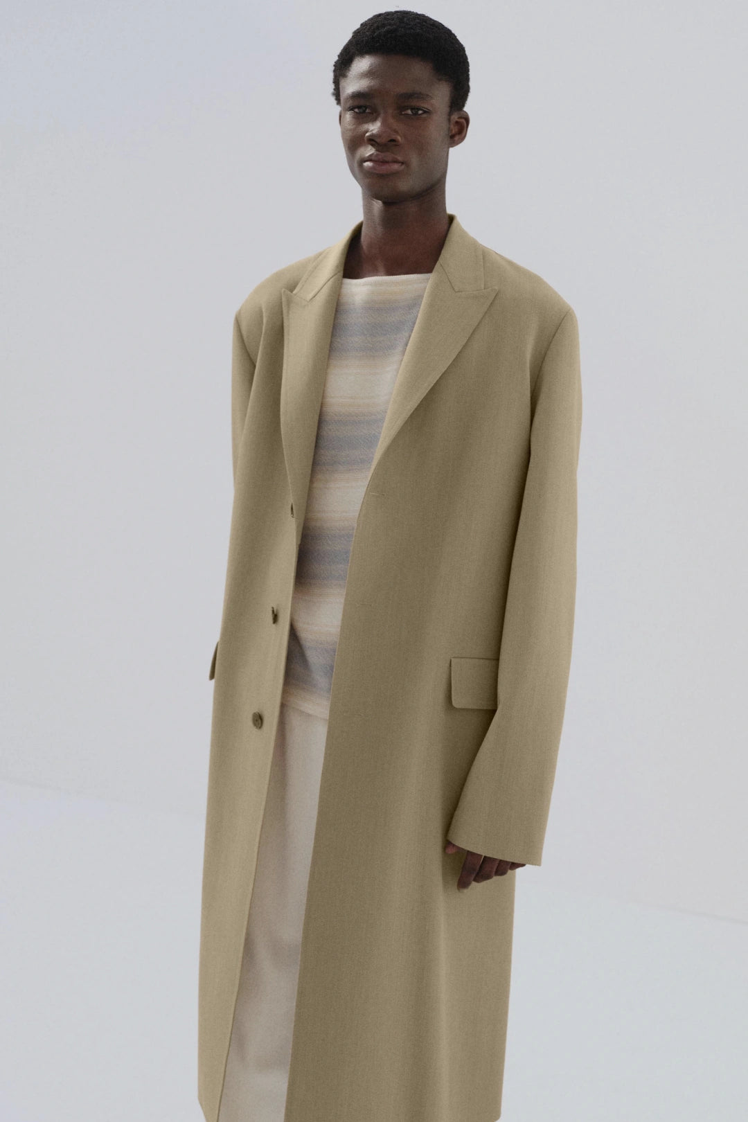 Model in beige overcoat